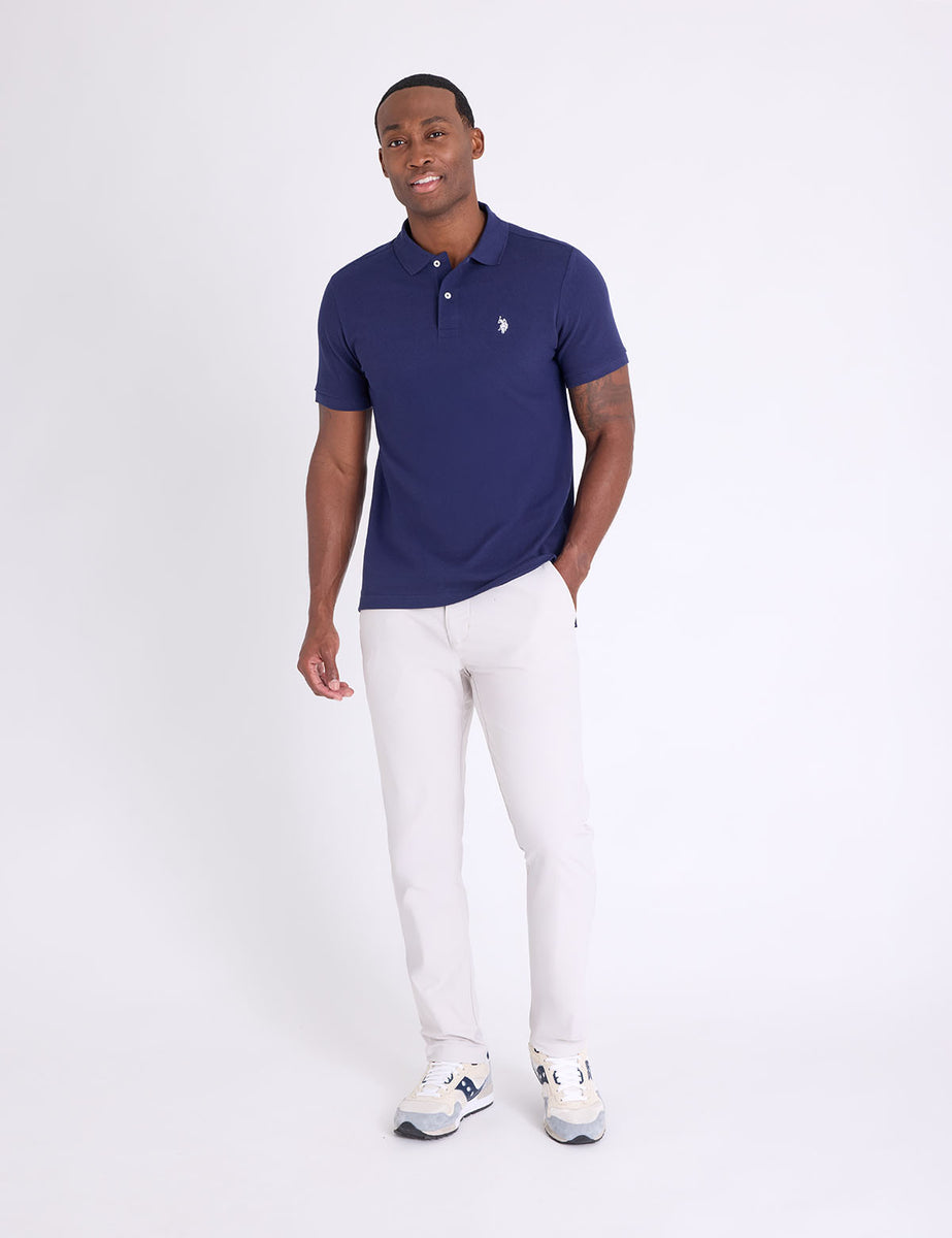 STRETCH TECH PANT WITH ZIPPER POCKETS– U.S. Polo Assn. STRETCH TECH PANT WITH ZIPPER POCKETS– U.S. Polo Assn.